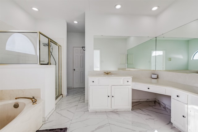 bathroom with vanity, a healthy amount of sunlight, and shower with separate bathtub