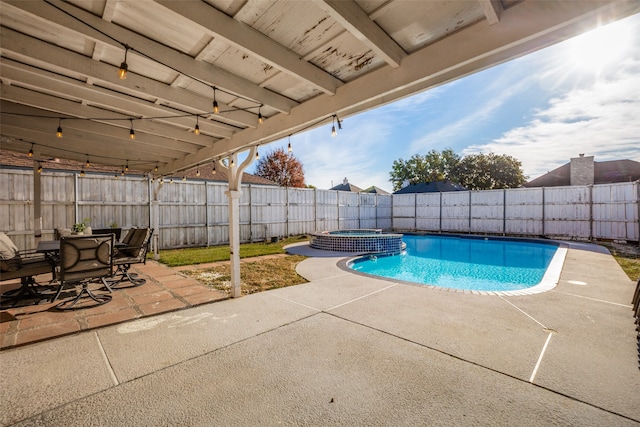 view of pool with an in ground hot tub and a patio area