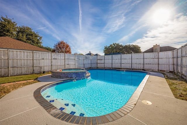 view of swimming pool featuring an in ground hot tub