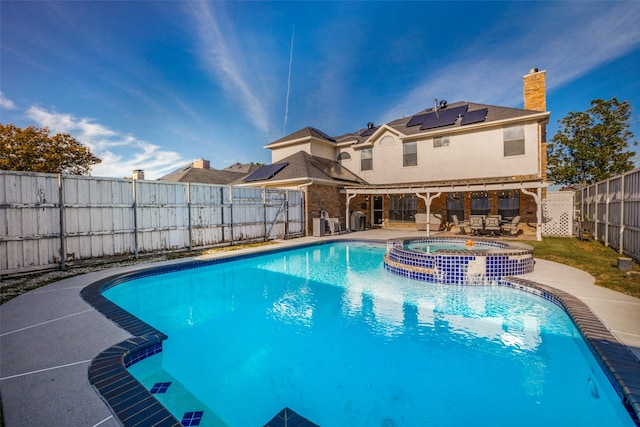 view of pool featuring an in ground hot tub and a patio