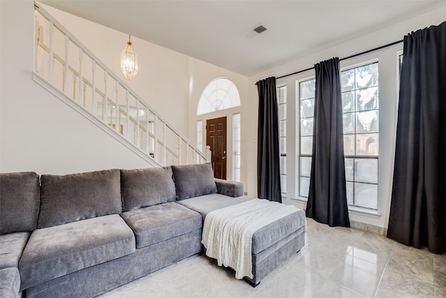 living room featuring a notable chandelier