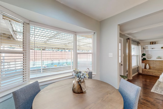 dining space featuring dark wood-type flooring