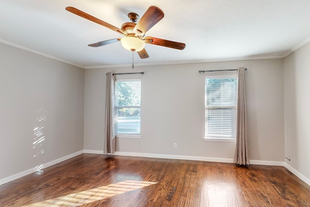 empty room featuring crown molding, dark hardwood / wood-style flooring, and ceiling fan