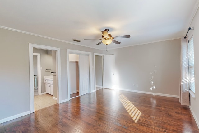 unfurnished room with ceiling fan, crown molding, and light hardwood / wood-style flooring