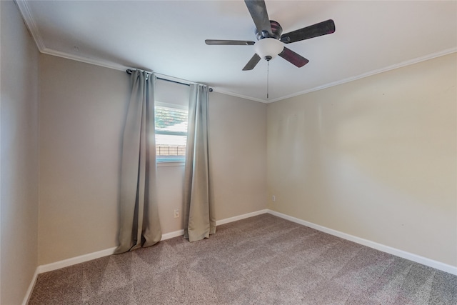 carpeted spare room featuring ceiling fan and ornamental molding