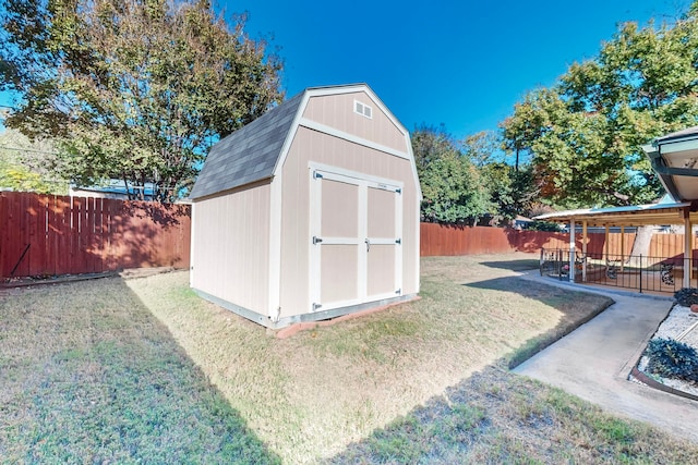 view of outdoor structure featuring a lawn