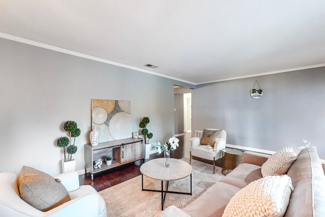 living room with hardwood / wood-style floors and crown molding