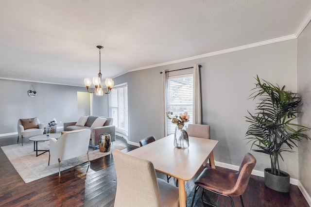 dining area featuring a chandelier, dark hardwood / wood-style floors, and ornamental molding