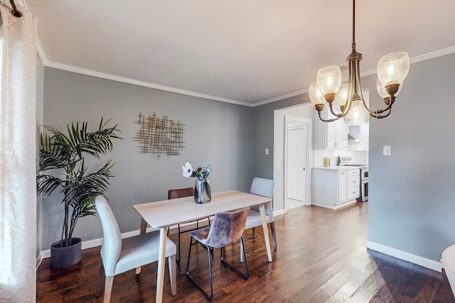 dining space featuring dark hardwood / wood-style flooring, a chandelier, and ornamental molding