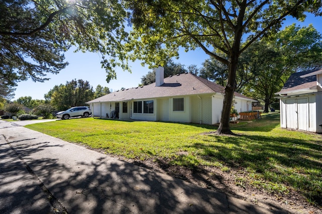 exterior space featuring a front lawn