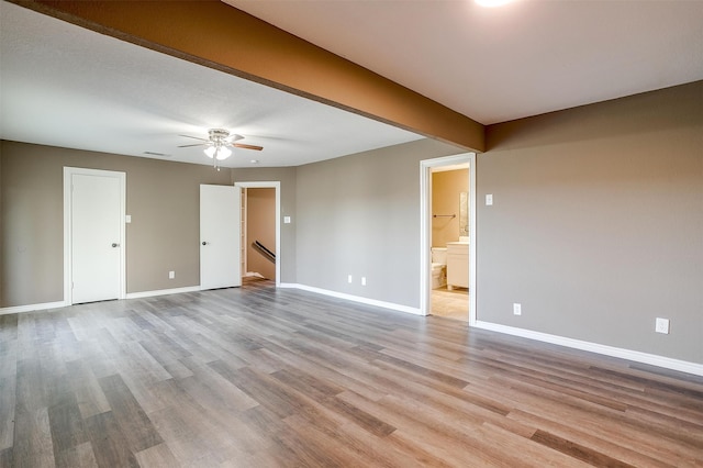 unfurnished room with light hardwood / wood-style flooring and ceiling fan