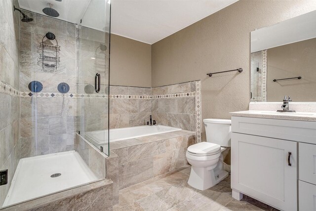 full bathroom featuring plus walk in shower, vanity, and toilet