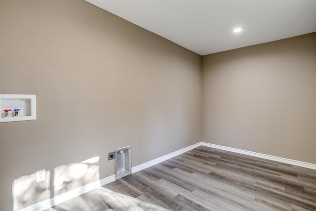 laundry room featuring washer hookup, hookup for an electric dryer, and light hardwood / wood-style flooring