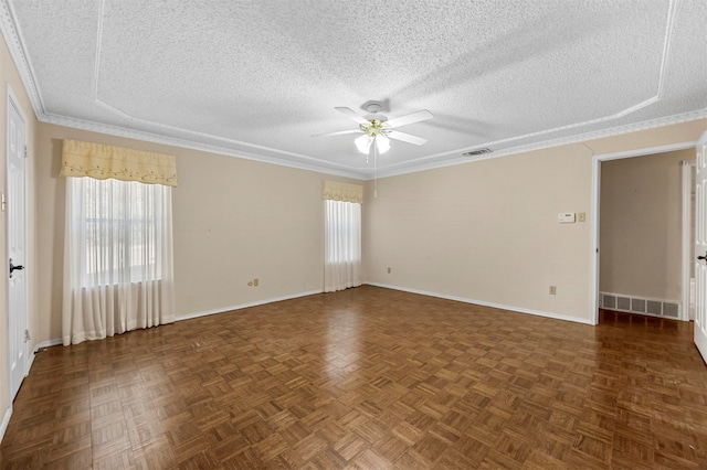 unfurnished room with dark parquet flooring, crown molding, ceiling fan, and a textured ceiling