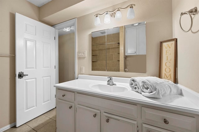 bathroom featuring tile patterned flooring and vanity