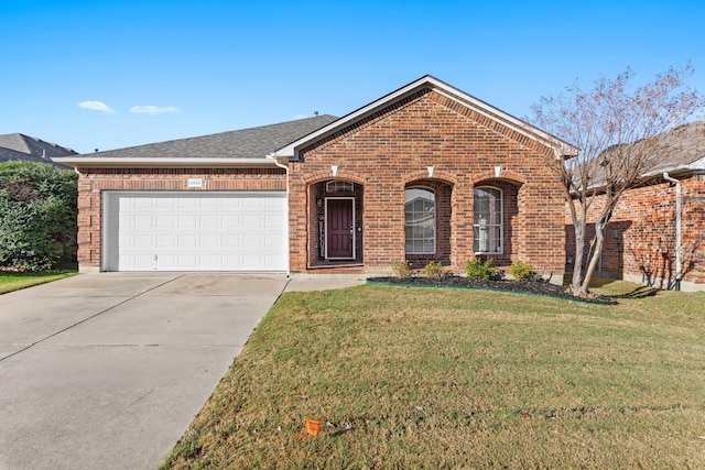 view of front facade with a front yard and a garage