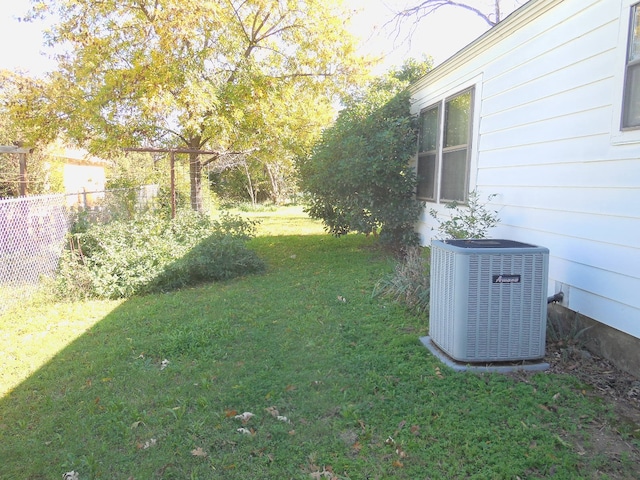 view of yard with central air condition unit