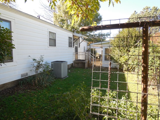 view of yard featuring central AC unit