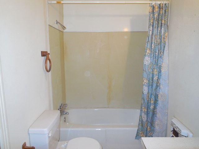 bathroom with shower / tub combo and toilet