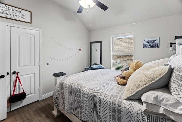 bedroom with dark hardwood / wood-style floors, ceiling fan, and lofted ceiling