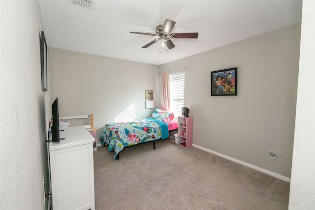 bedroom with ceiling fan and light carpet