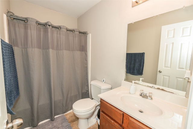 full bathroom with tile patterned flooring, vanity, shower / tub combo with curtain, and toilet