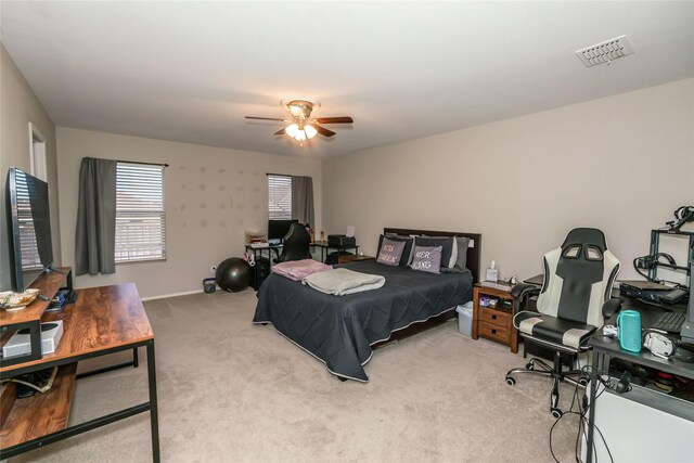 carpeted bedroom with ceiling fan