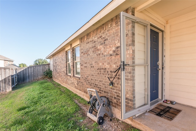 view of home's exterior featuring a yard