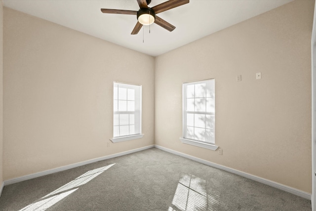 carpeted empty room with ceiling fan