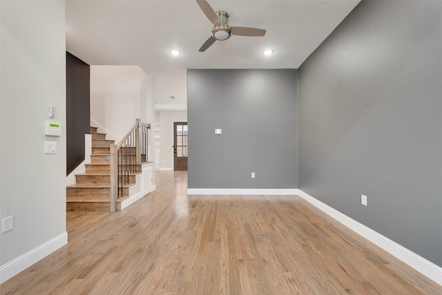 empty room with light hardwood / wood-style flooring and ceiling fan