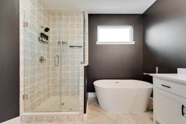 bathroom featuring vanity and shower with separate bathtub