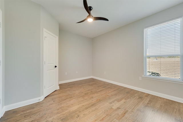 unfurnished room with ceiling fan and light hardwood / wood-style floors