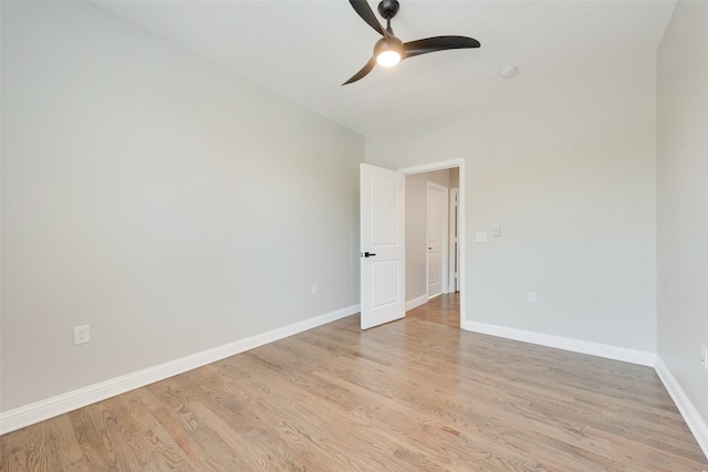 spare room with light wood-type flooring and ceiling fan