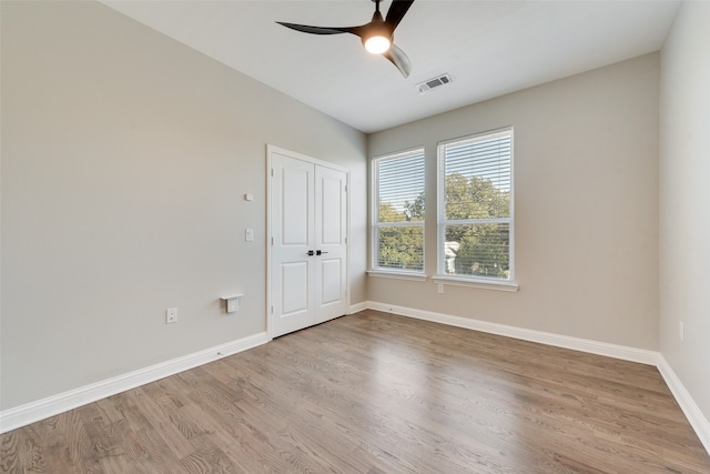 spare room with ceiling fan and light hardwood / wood-style flooring