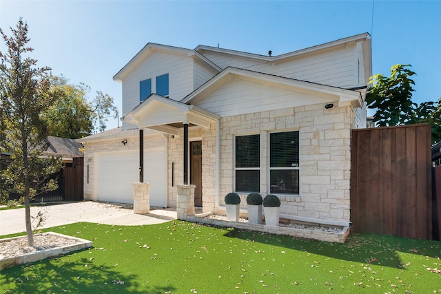 view of front of home featuring a front lawn and a garage