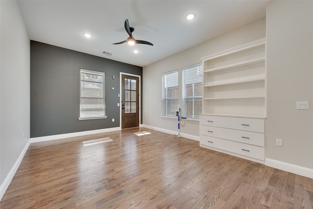 interior space featuring a wealth of natural light, light hardwood / wood-style flooring, and ceiling fan