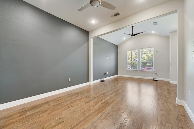 unfurnished room featuring vaulted ceiling with beams, ceiling fan, and light wood-type flooring