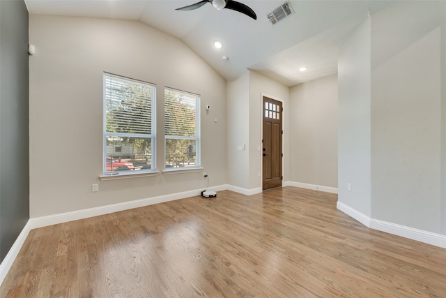 foyer with ceiling fan, light wood-type flooring, and lofted ceiling