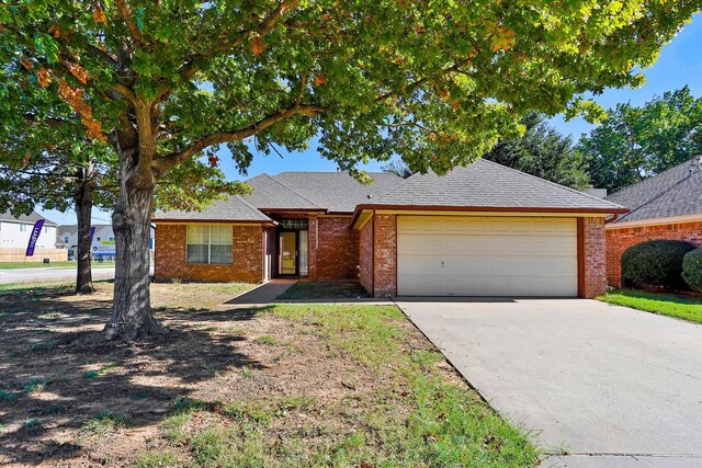 single story home featuring a garage