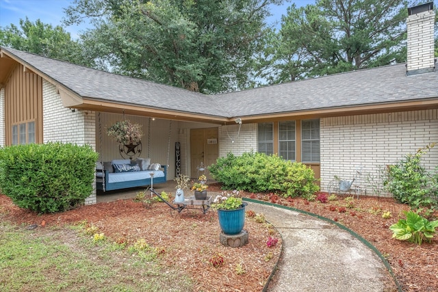 view of exterior entry featuring an outdoor hangout area