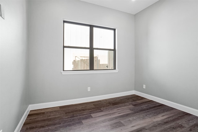 unfurnished room with dark hardwood / wood-style floors