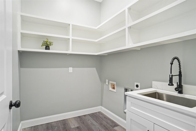 laundry room with sink, cabinets, dark wood-type flooring, hookup for an electric dryer, and hookup for a washing machine