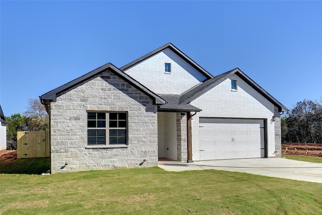 view of front of house featuring a front lawn and a garage