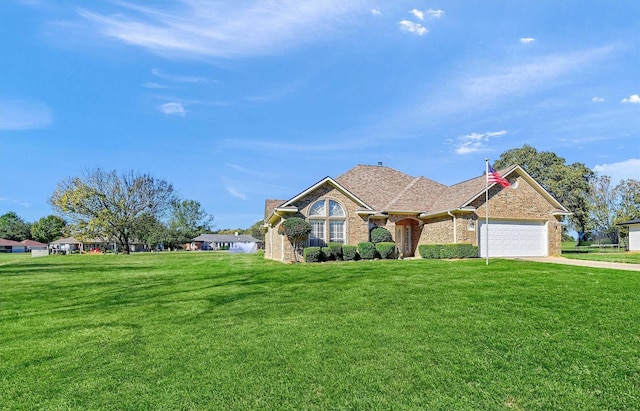 view of front facade with a garage and a front yard