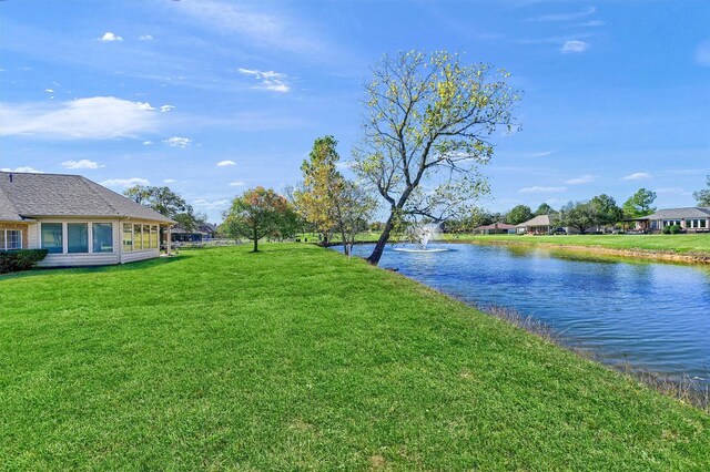 view of front of property with a front lawn and a garage