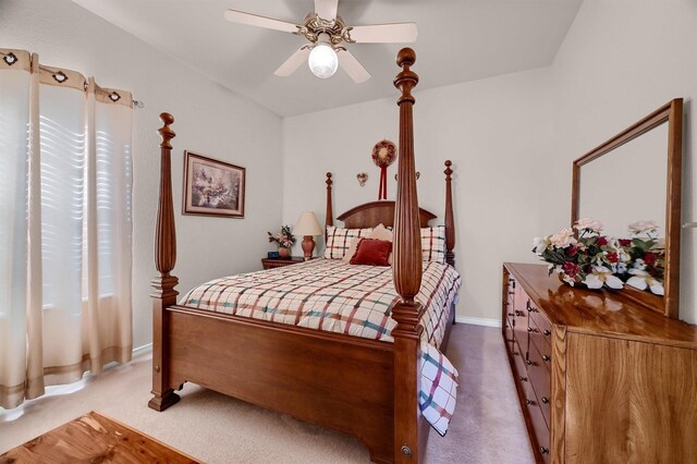 bedroom featuring ceiling fan and carpet