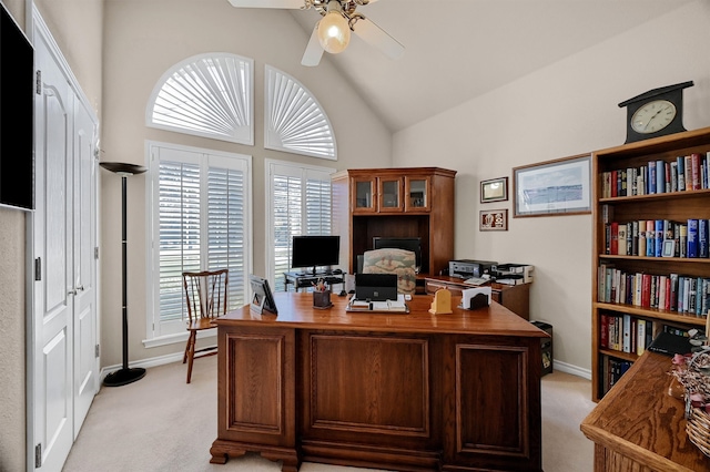 carpeted office featuring vaulted ceiling and ceiling fan