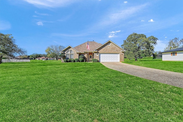 single story home featuring a front yard and a garage