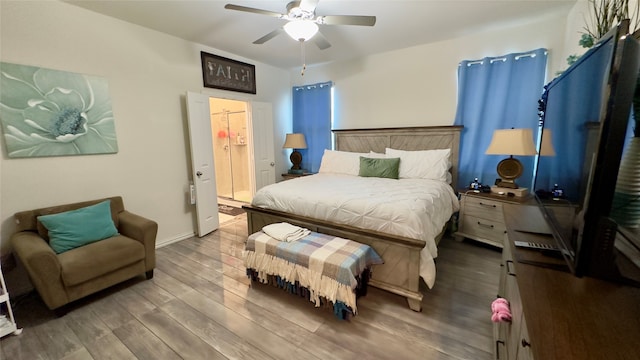 bedroom with hardwood / wood-style flooring and ceiling fan