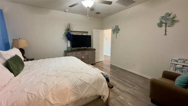 bedroom featuring ceiling fan and wood-type flooring